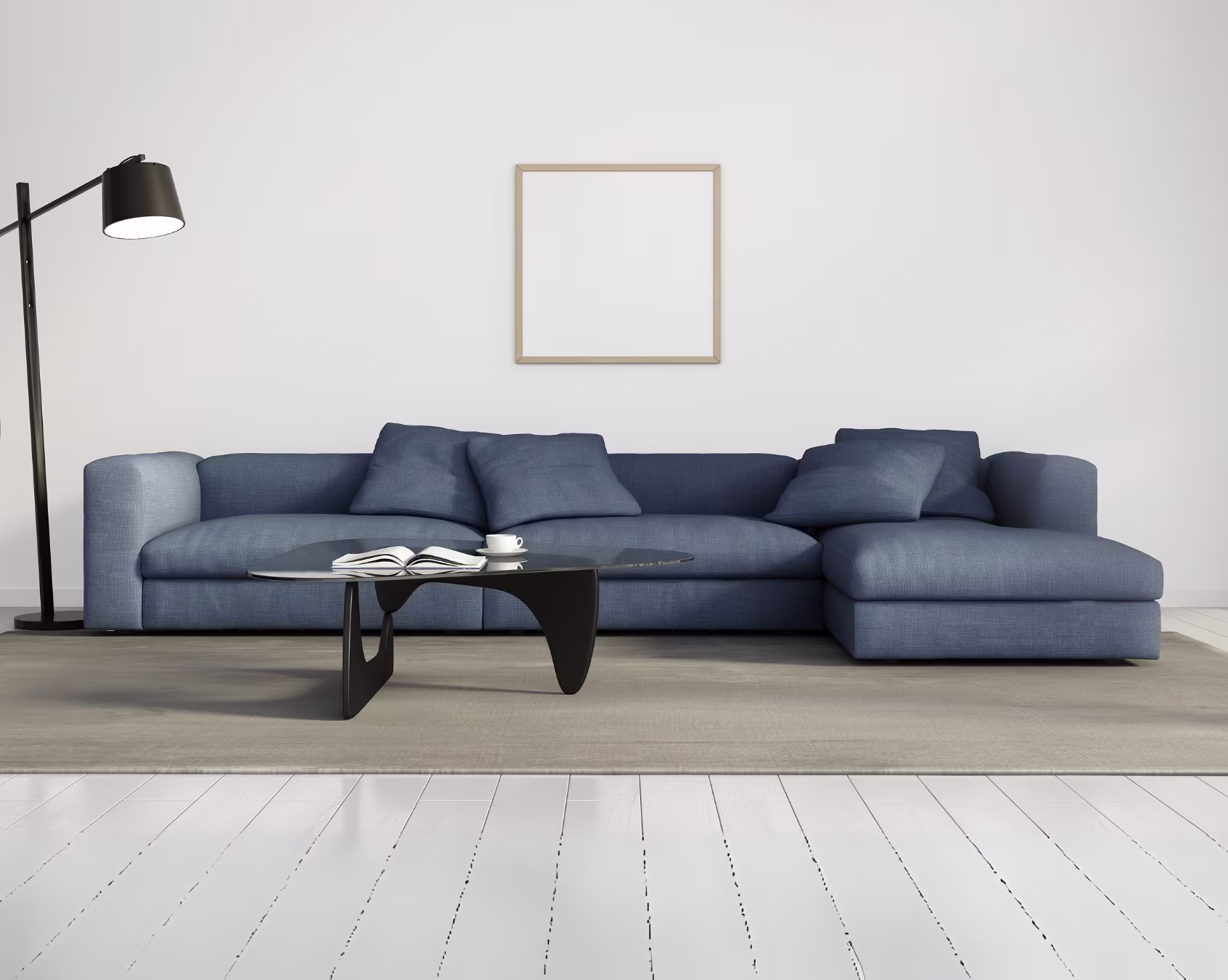 Modern blue sectional sofa with cushions and coffee table in a minimalist living room