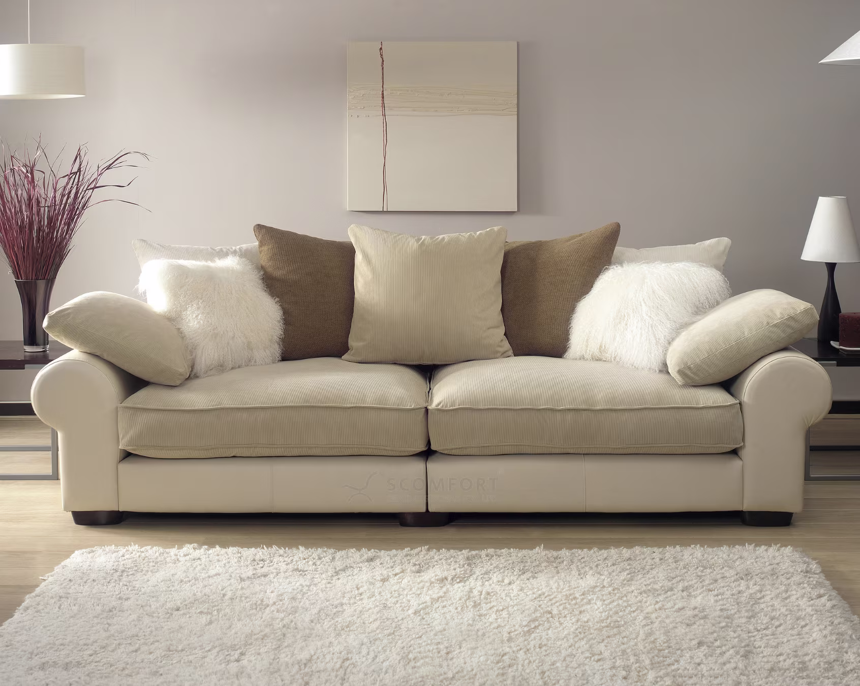 Elegant beige sofa with decorative cushions in a modern living room