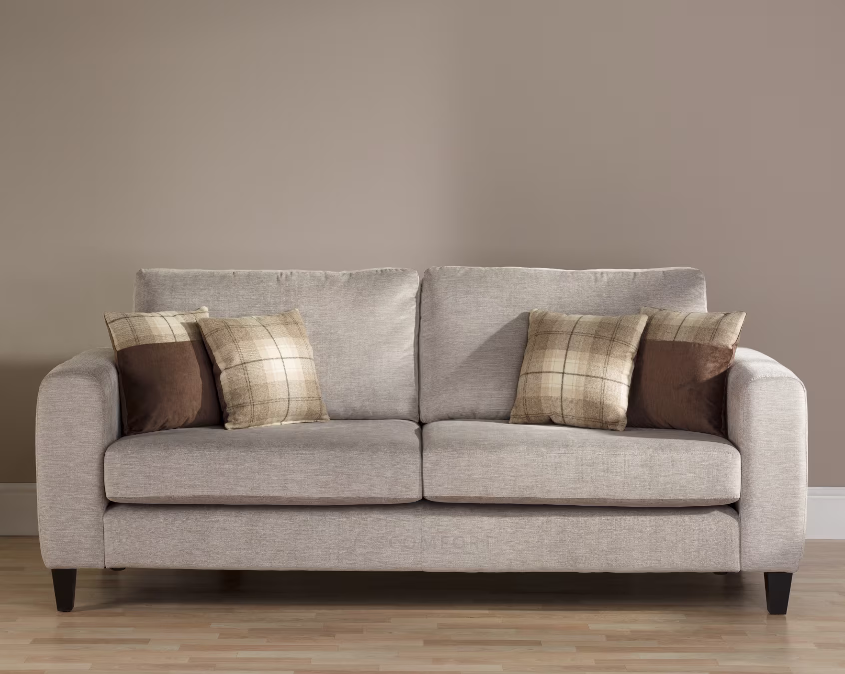 Light grey fabric sofa with plaid and solid cushions in a modern living room