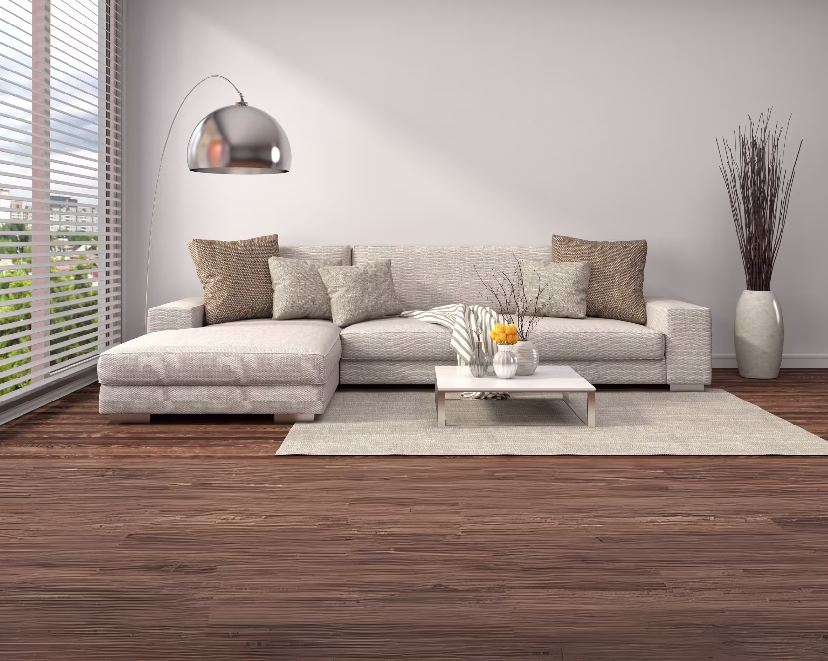 Modern light gray sectional sofa with cushions in a stylish living room