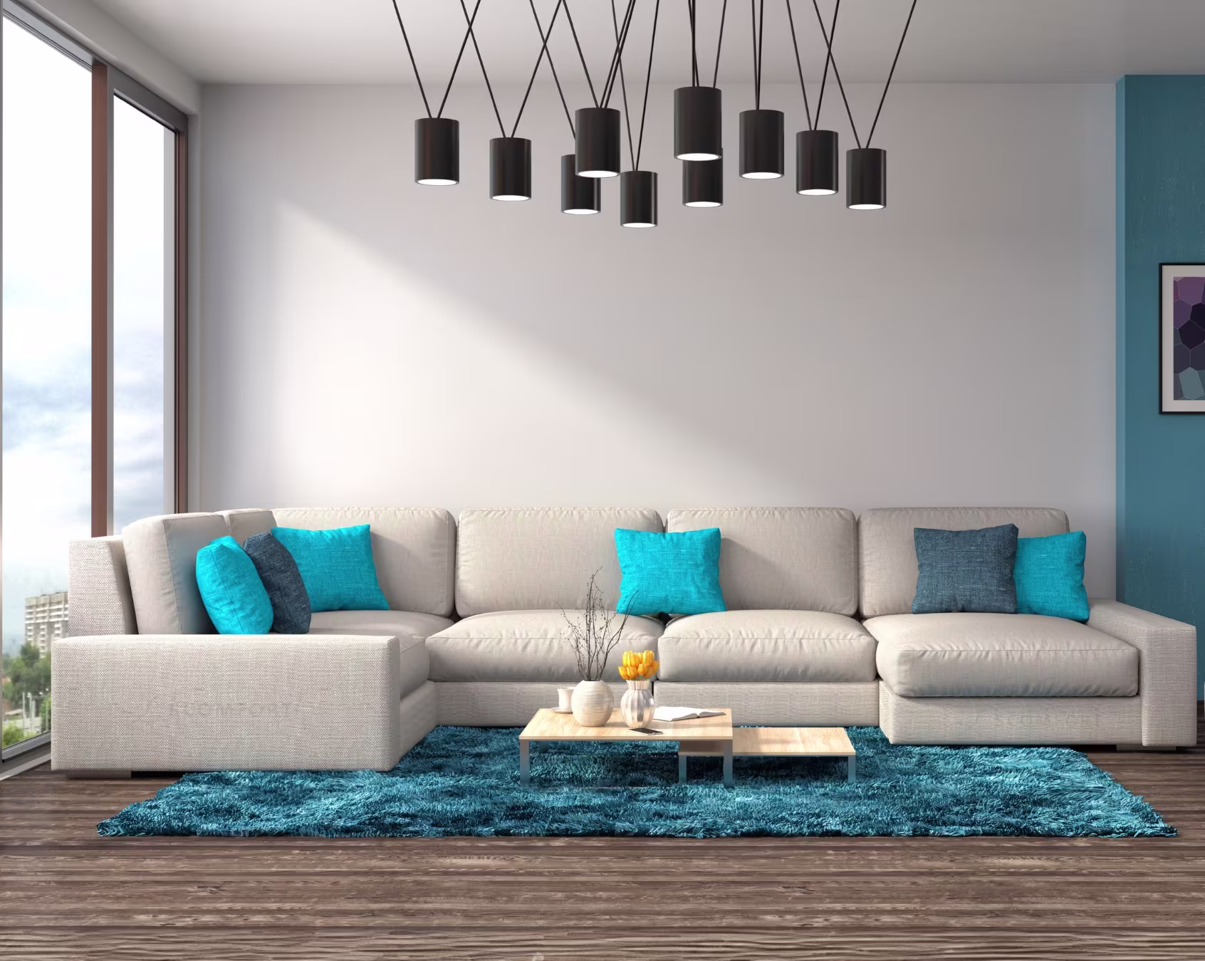 Modern living room with beige sectional sofa, blue cushions, and contemporary lighting