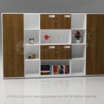 Large modular office storage system with a white frame and light wood doors, featuring low cabinets, open bookshelves, and tall closed storage sections.